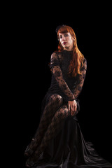 girl on a black gothic dress with red hair 