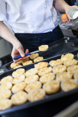 Chef preparing desserts removing them from moulds