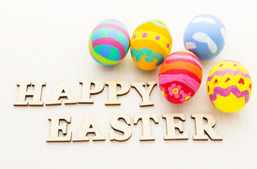 Colourful design easter egg and wooden word