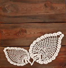 vintage doily on a wooden background - 62951853