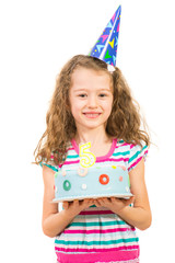 Smiling girl with birthday cake