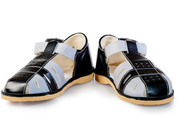 pair of leather sandals for children isolated on white backgroun