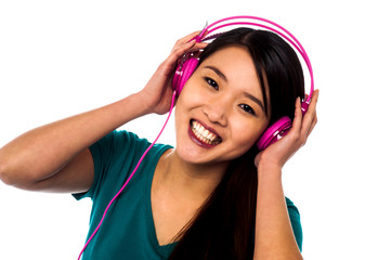 Adorable girl listening to music