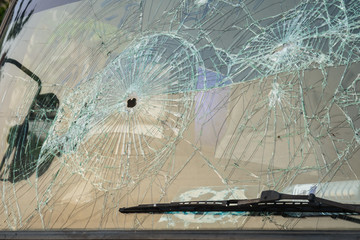 Car with bullet holes in the windshield