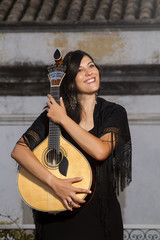 beautiful woman dressed as a fado performer