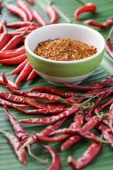 Three type of chili on banana leaf, dry, fresh and ground.