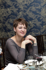 Happy woman in restaurant