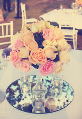 Rose flower arrangement for wedding table,vintage filter effect