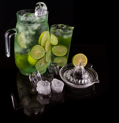 Lime juice over black background