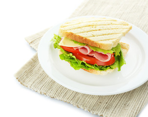 Tasty sandwich with ham, isolated on white