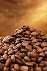 Coffee beans on table on brown background