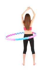 Woman doing exercises with hula hoop isolated on white