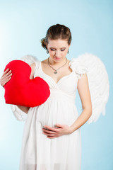 Portrait of a beautiful angelic pregnant woman