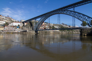 Fototapeta na wymiar Ancient city Porto,metallic Dom Luis bridge , Portugal