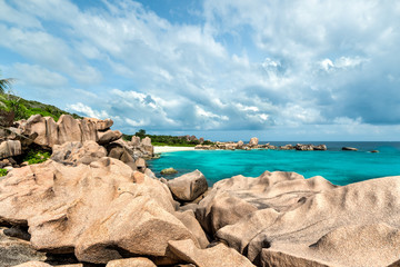 tropical turquoise sea with granite boulders