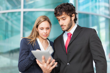 Business people using a tablet
