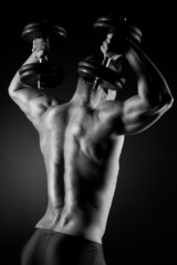 Fototapeta na wymiar Muscular man weightlifting