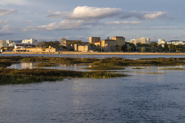 Naklejka premium city of Faro, Portugal, creating a reflection on the water.