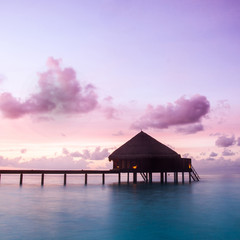 Over water bungalows with steps into amazing green lagoon