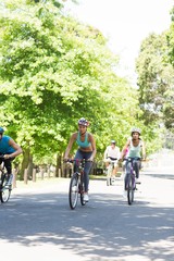 Naklejka premium Group of cyclists riding bikes