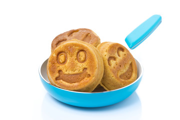 corn pancake in a frying pan, isolated
