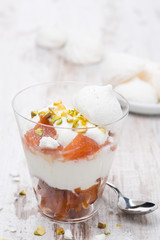 dessert with canned peaches, whipped cream and meringue