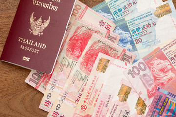 Thailand passport with hongkong currency