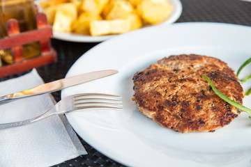 Grilled meat cutlet served