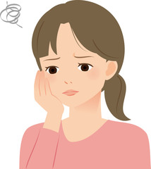 表情を曇らせる若い女性