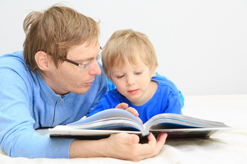 Fototapeta na wymiar Father and son reading together