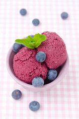 refreshing blueberry sorbet and fresh blueberries, top view