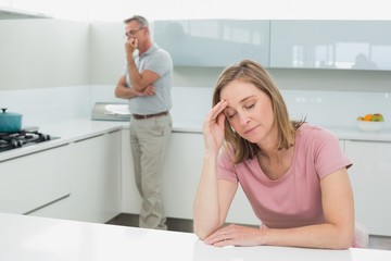 Couple not talking after an argument in kitchen