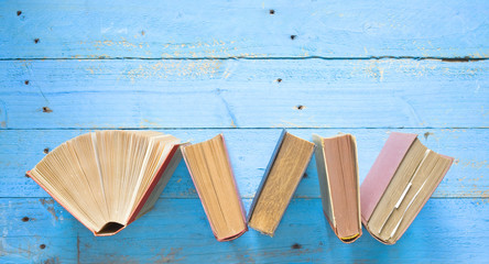 vintage books, one open, top view, free copy space