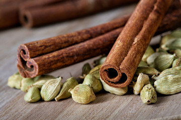 Still-life from cardamom and cinnamon close up