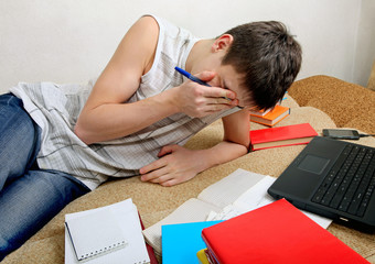 Tired Teenager preparing for Exam