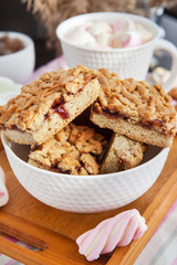 Jam filled bar cookies and cup of hot cocoa