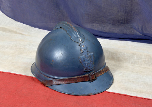 french ww 1 helmet on the antique french flag