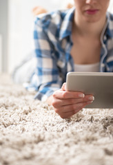 Relaxing in the living room with tablet