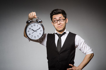 Businessman with clock in time concept