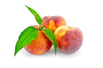 Peaches whole with green leaves