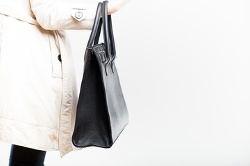 Fashionable woman with black leather bag