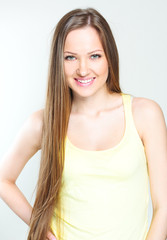 Fototapeta premium Beautiful young woman with long hair