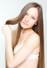 Obraz premium closeup portrait of a beautiful young woman with elegant long sh
