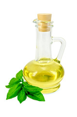 Vegetable oil in a carafe with basil