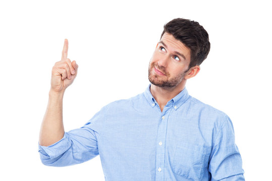 Young man pointing up