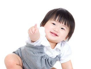 Asian baby girl finger pointing toward front