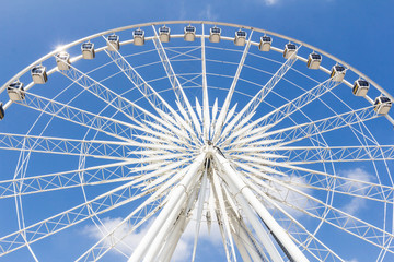 ferris wheel against blue sky
