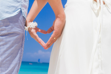 young loving couple on wedding day on tropical sand beach