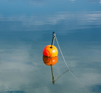 Orange Buoy In The Lake