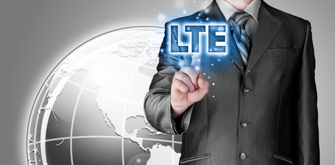 businessman is pushing his finger on lte button
